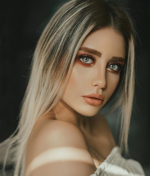 Young woman looking into distance with calm and clear eyes